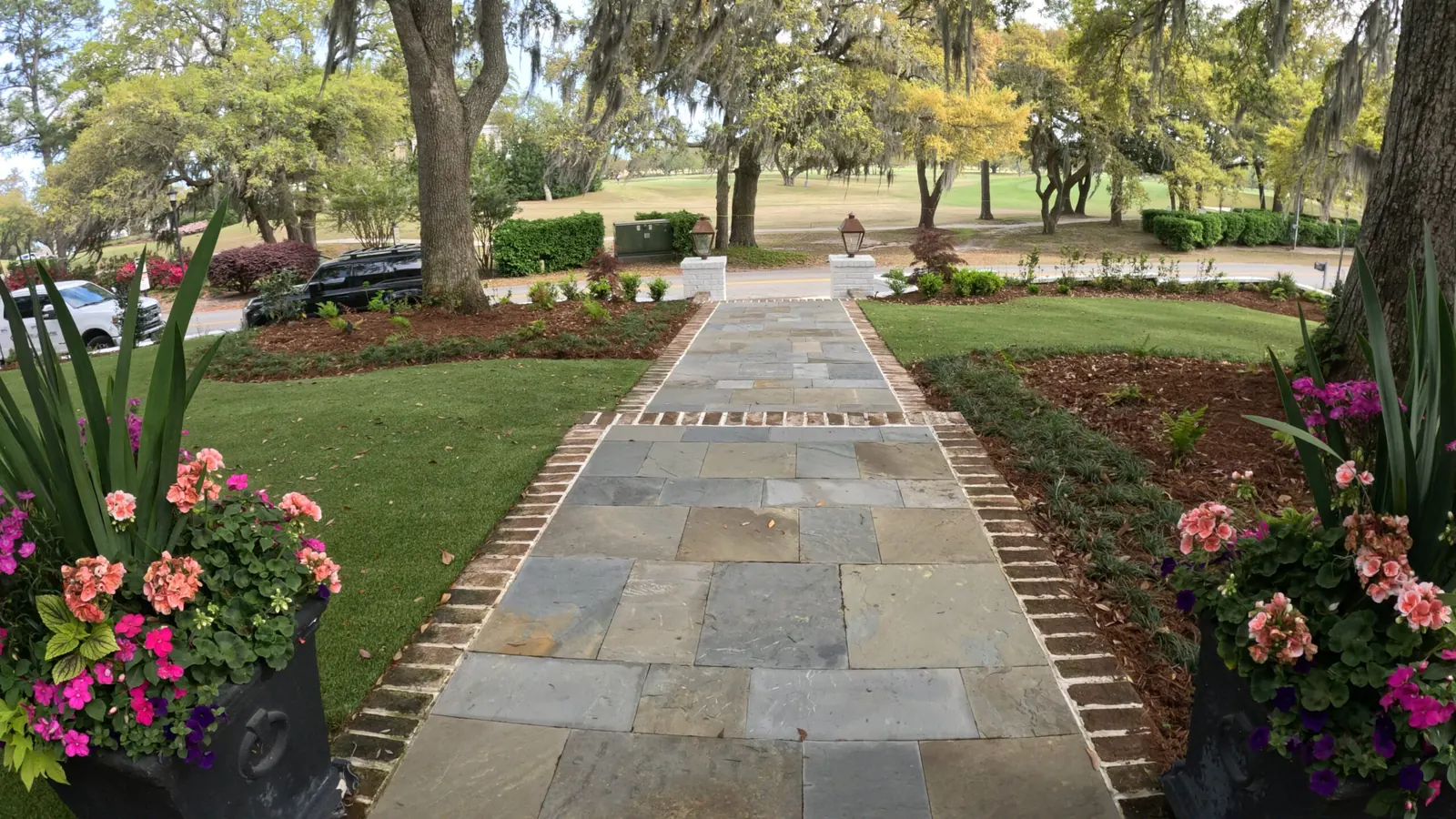 Bluestone walkway with brick edging and planted beds by Cramers Landscaping, Charleston area Bluestone walkway with brick edging and planted beds by Cramers Landscaping, Charleston area