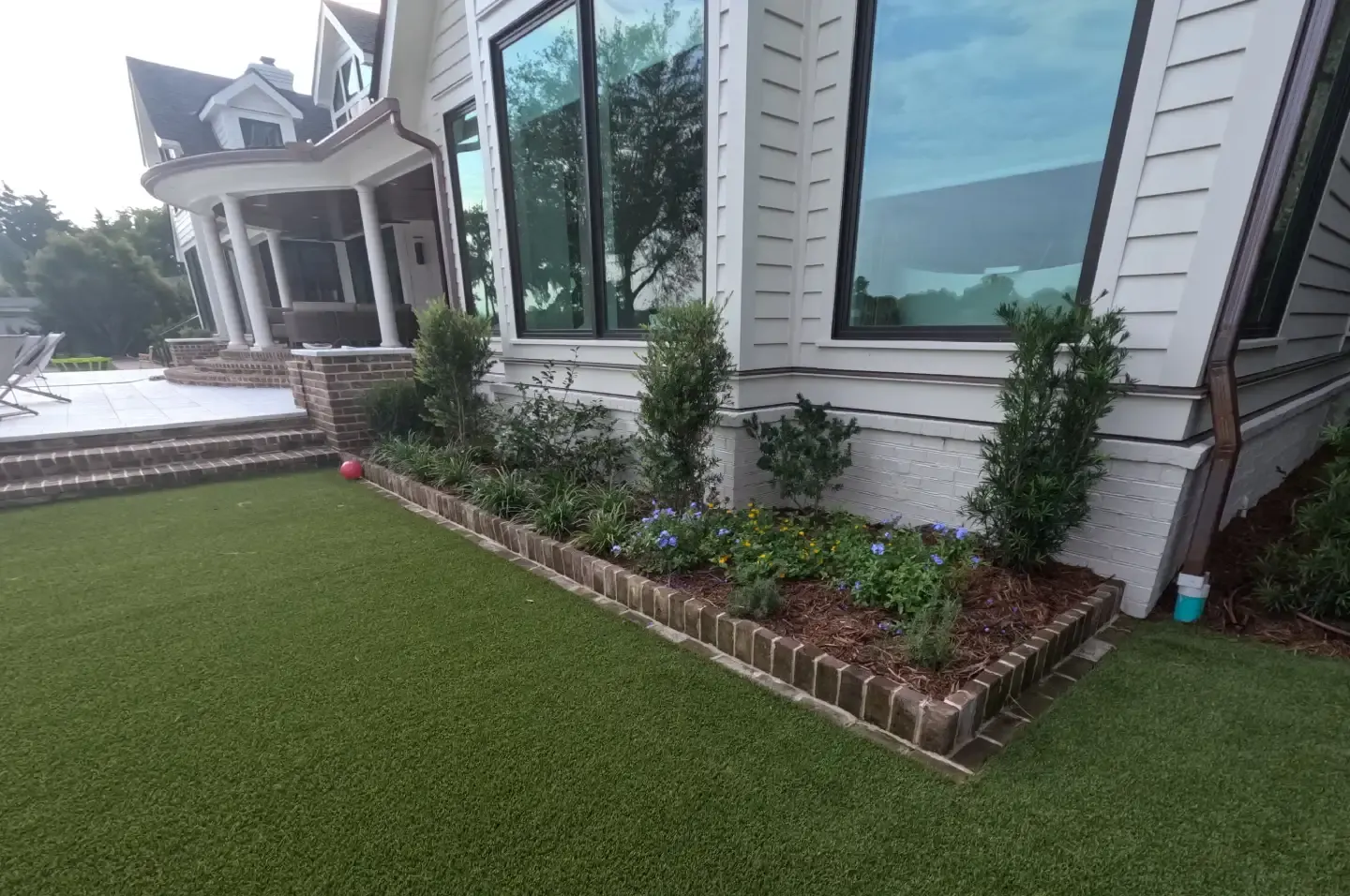 Brick-edged planting bed along a lawn by Cramers Landscaping, Charleston area Brick-edged planting bed along a lawn by Cramers Landscaping, Charleston area