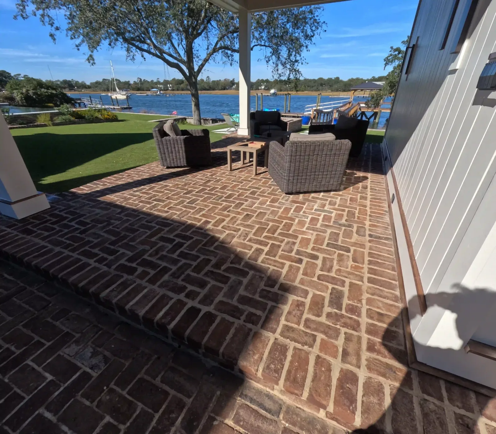 Herringbone brick patio under a pavilion on the waterfront in Charleston, SC