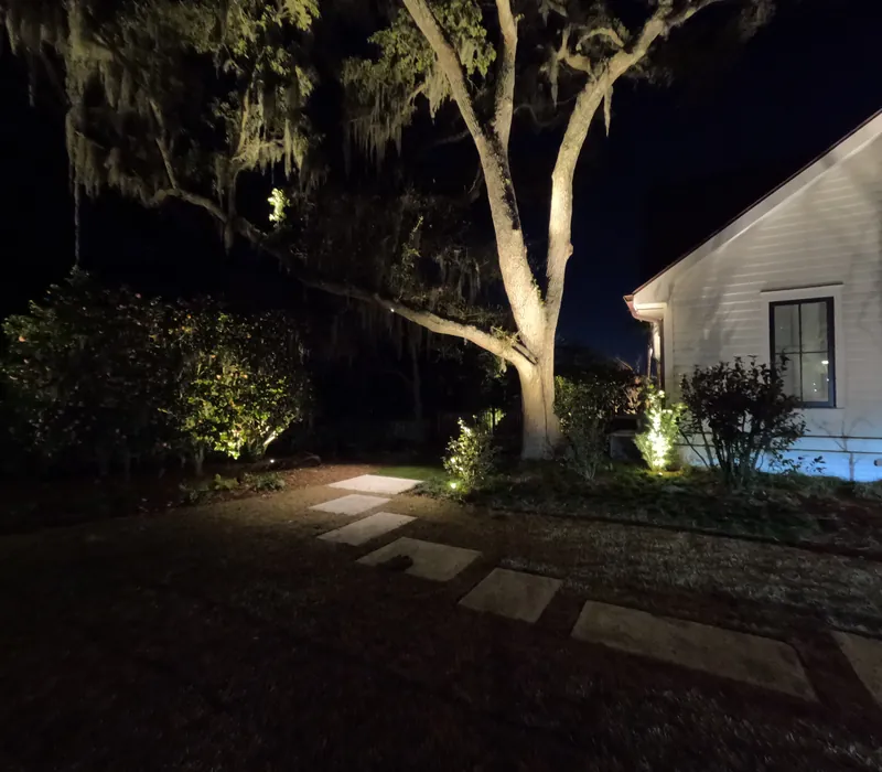 Charleston stepping stone path uplit oak lit house corner