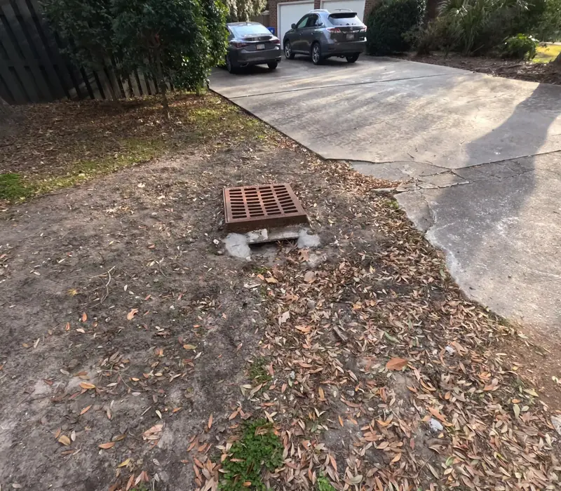 Storm drain basin set at the low point of a driveway in James Island, SC