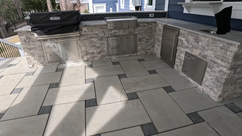 L-shaped stone outdoor kitchen with a granite top in Summerville, SC