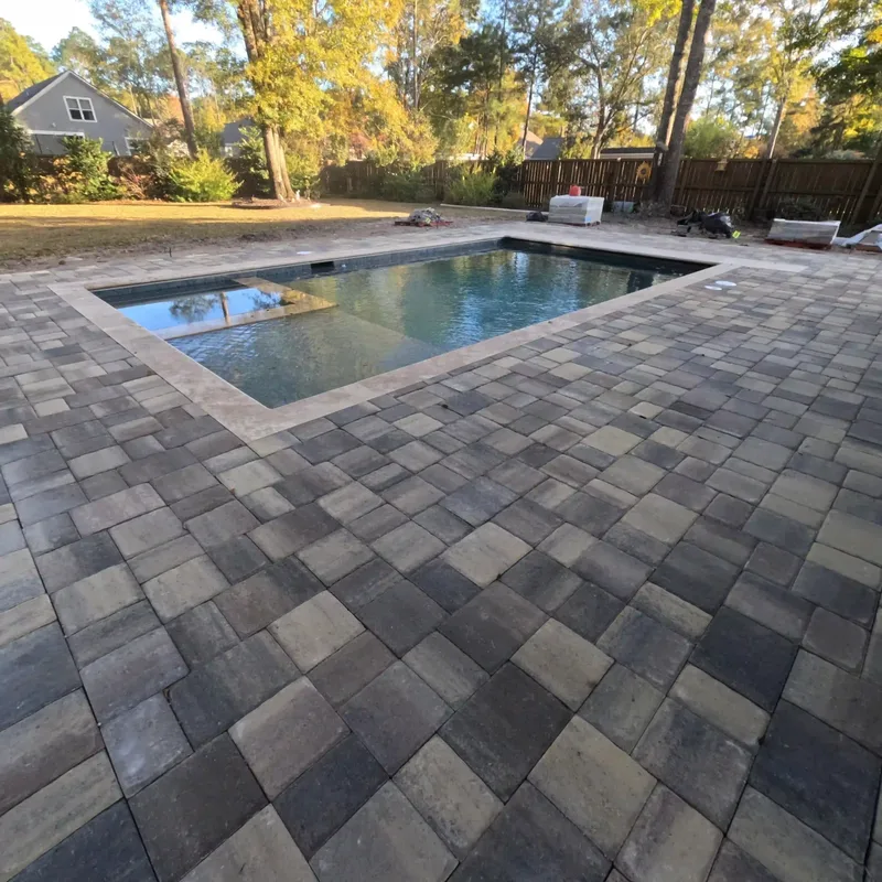 Paver pool deck around a rectangular pool in Summerville, SC