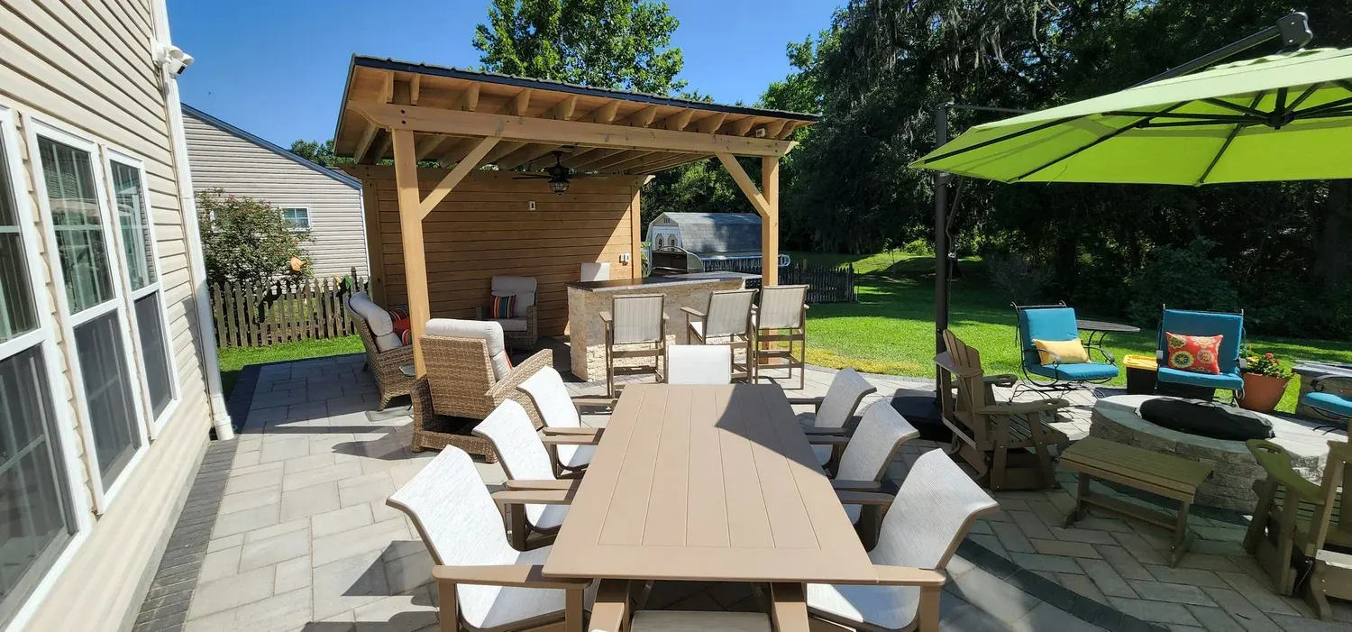 Paver patio furnished with a dining table and lounge seating in Summerville, SC