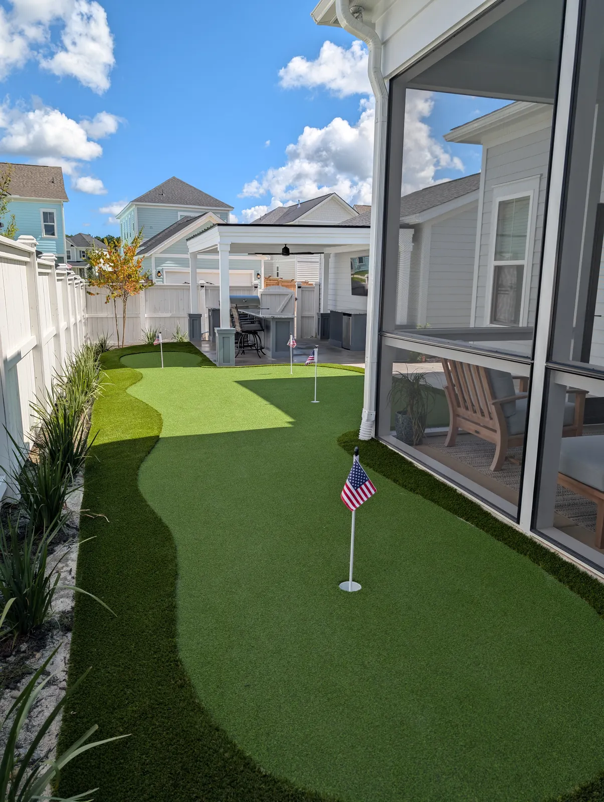 Putting green beside a modern pergola in Summerville, SC Putting green beside a modern pergola in Summerville, SC