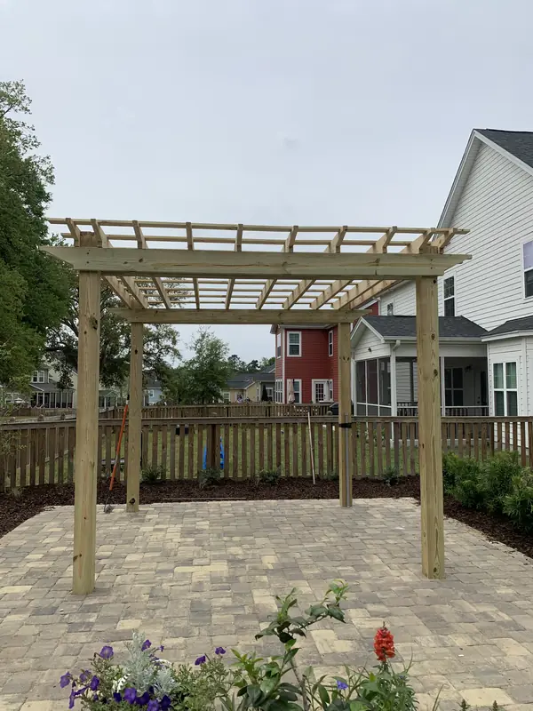 Wood pergola over a paver patio in Summerville, SC