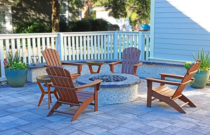 Tabby fire pit with Adirondack seating by Cramers Landscaping, Charleston area