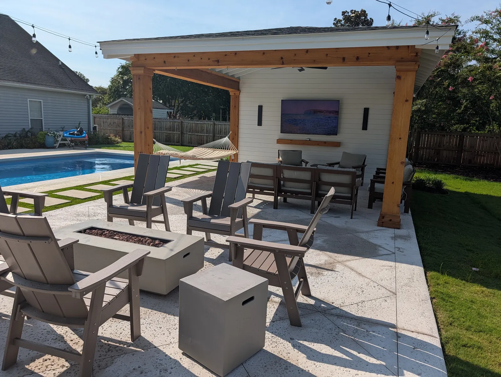 Backyard hardscape fire pit and pavilion in West Ashley, SC