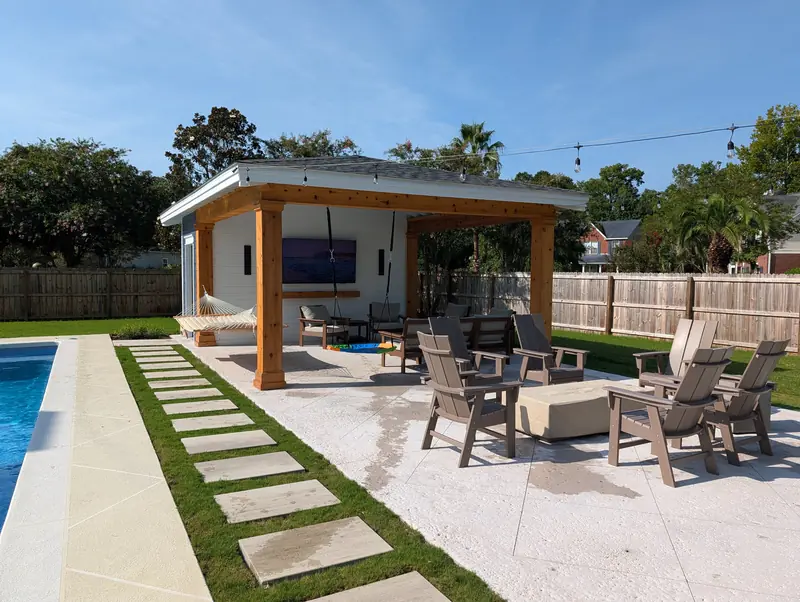 Covered poolside patio cabana with seating in West Ashley, SC