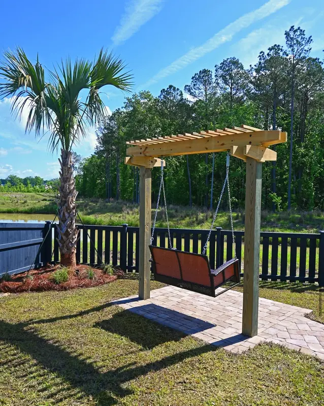 Backyard pergola swing by Cramers Landscaping, Charleston area