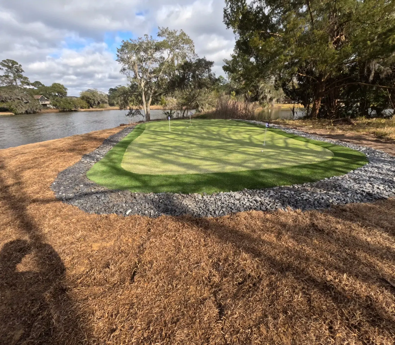 Waterfront putting green with a slate border in Charleston, SC Waterfront putting green with a slate border in Charleston, SC